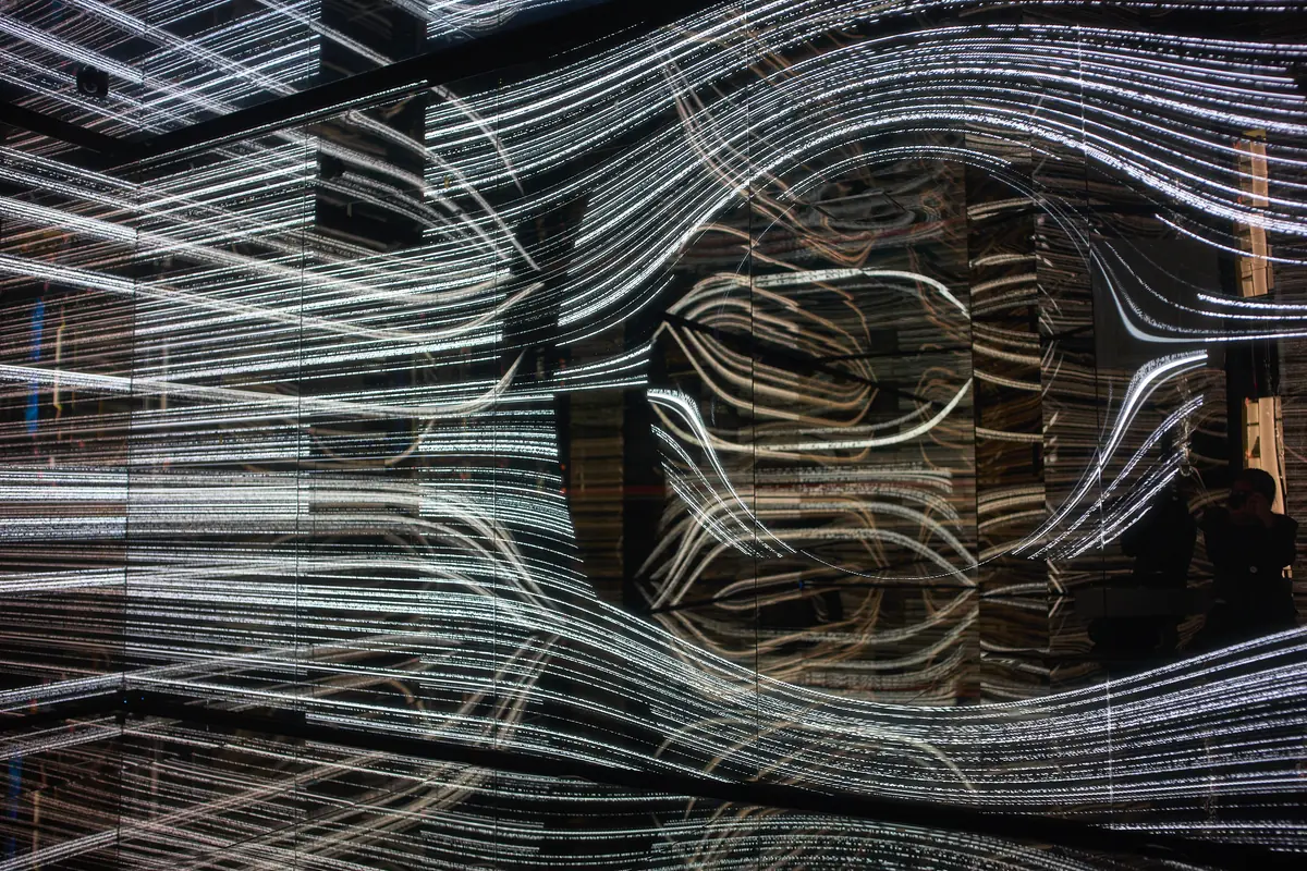White light lines bending through mirrors