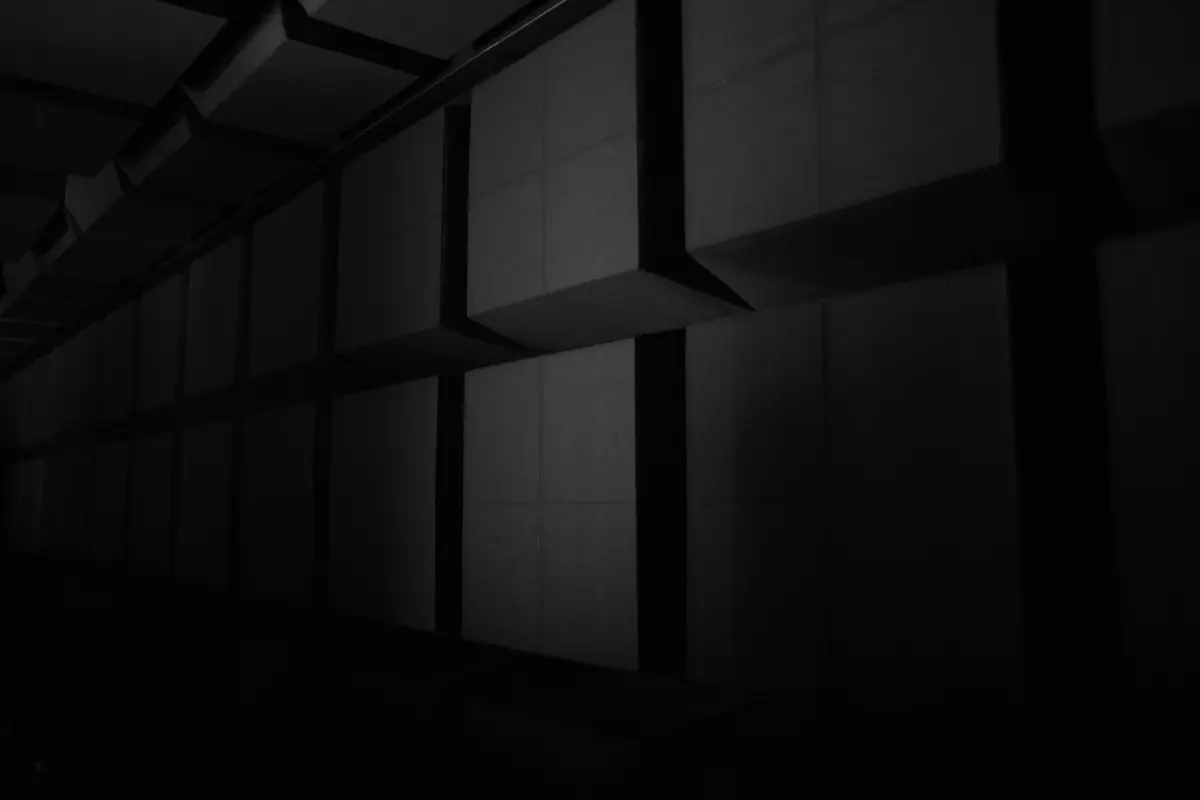 A wall of speakers in the dark